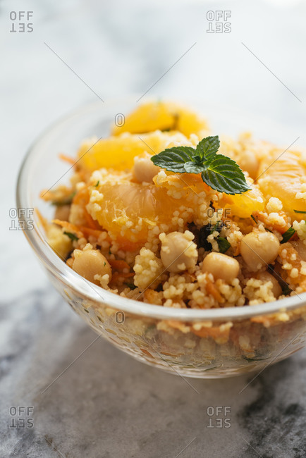 Salad with couscous, tangerines, orange, chickpeas, parsley and mint