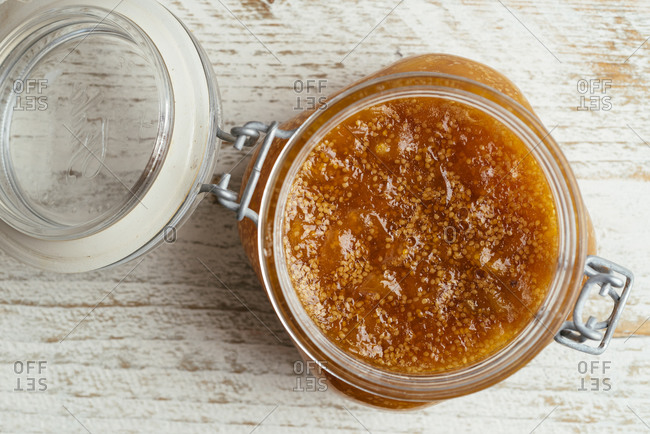 Overhead view of homemade physalis and chamomile jam in a jar