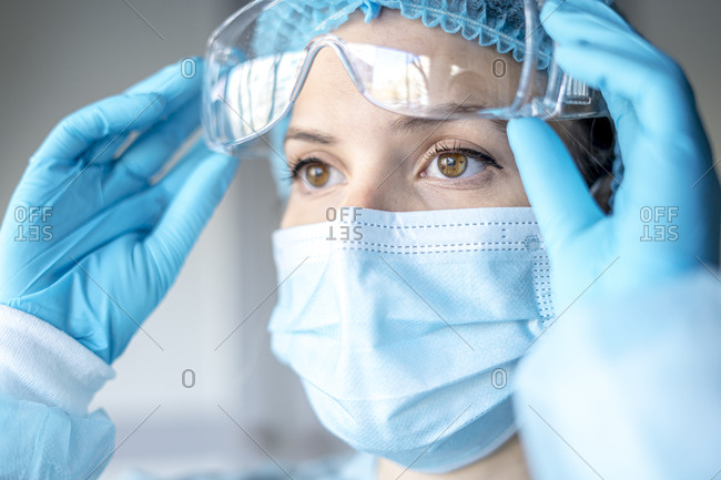 Medical surgical doctor and health care, portrait of surgeon doctor in ppe equipment on isolated background. medicine female doctors wearing face mask and cap for patients surgery work. medic