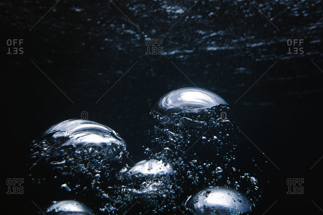 Big bubbles break the blue surface