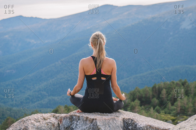 Woman meditating yoga mountain postures