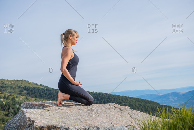 Woman meditating yoga mountain postures