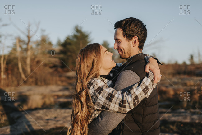 Young couple embracing during autumn hike