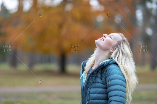 Carefree woman with eyes closed standing at Cannock Chase