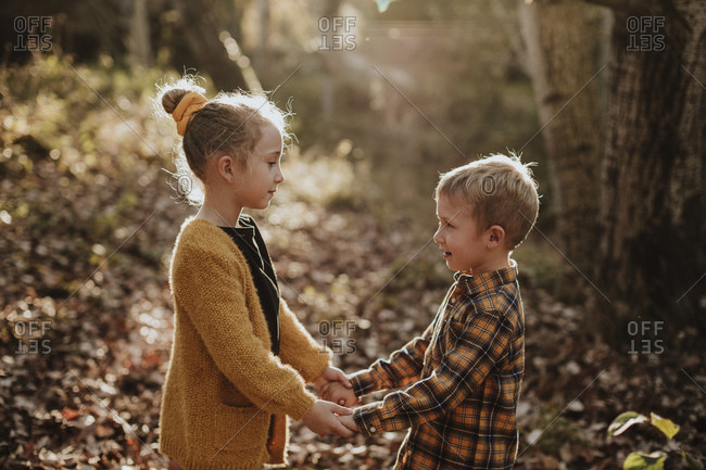 girl and boy holding hands