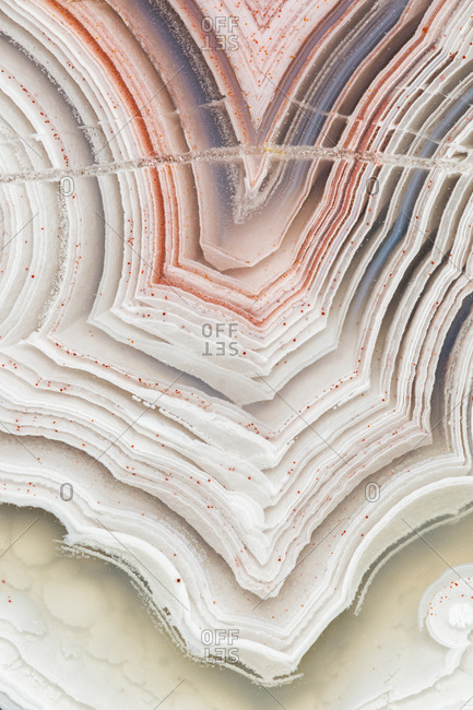 Extreme closeup of the banding patterns in a cut and polished Laguna lace agate from Mexico