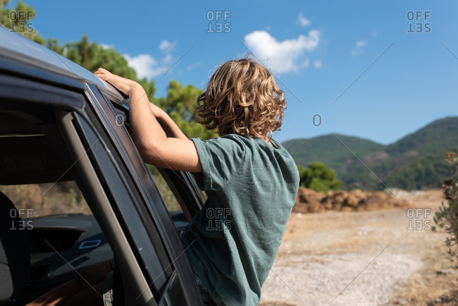 Premium Photo  Unrecognizable young man stands by the window