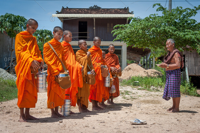 Monks Doing Alms, Kompong Cham Province, Cambodia - 20 August 2012: Monks Accept Donations From Local Members Of Their Commune.