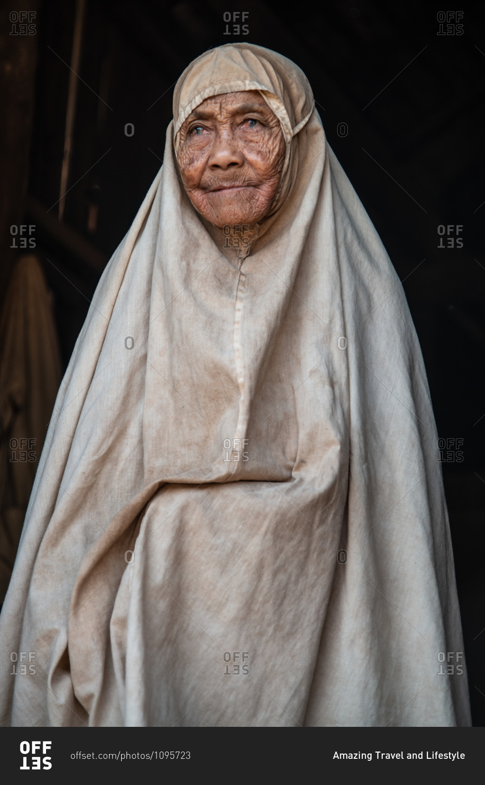 Portrait, Kratie Province, Cambodia - 26 February 2013:\
Muslim Woman Adorns A Full Hijab Style Gown In A Minority Village\
Of Ethnic Cham People. stock photo - OFFSET