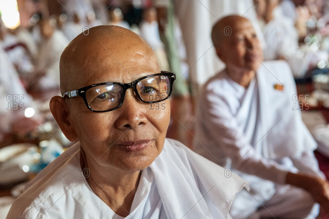 Portrait, Nun,  Vispassana Center , Udong, Cambodia - 04 October 2013: Nun Wearing Glasses Getting Ready For Pre-Lunch Payers Of Gratitude.