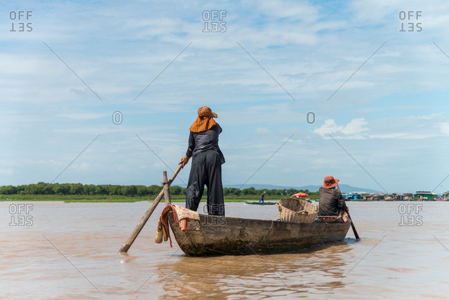 Kompong Luong Floating Village, Krakor District, Cambodia - 24 June 2014: Khmer Fisherman Returning To Cambodian Floating Village From Tonle Sap Lake.