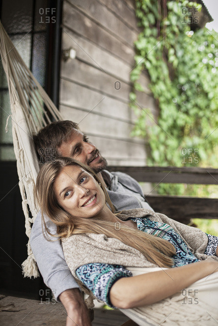 Thoughtful couple relaxing in hammock