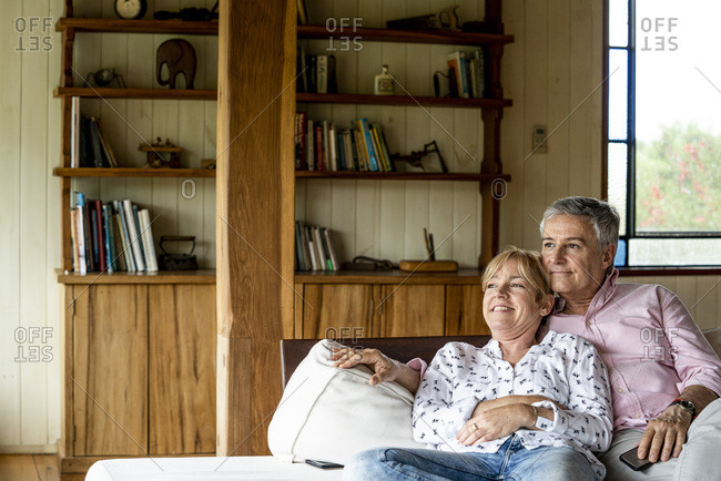 Senior couple relaxing in stilt hut
