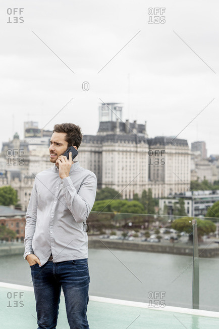 Young man talking on smartphone
