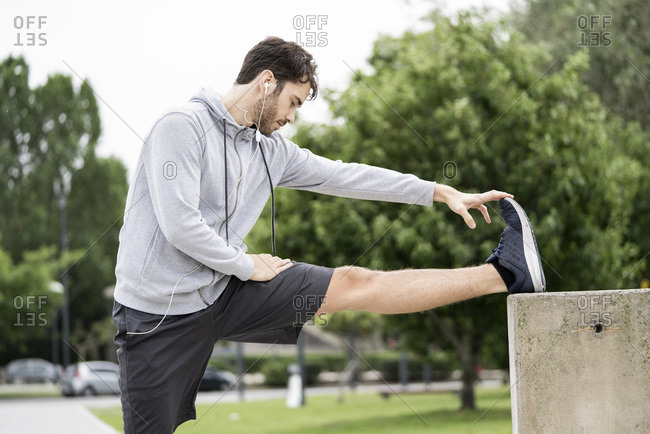 Young man exercising in public park