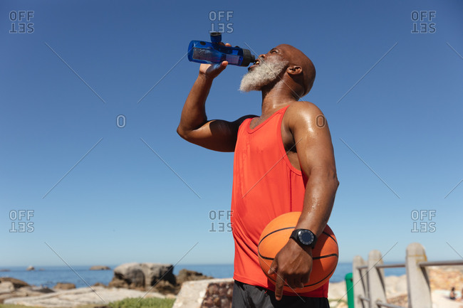 Portrait Of Senior Man Holding Bottle Of Water. Stock Photo, Picture and  Royalty Free Image. Image 46730788.