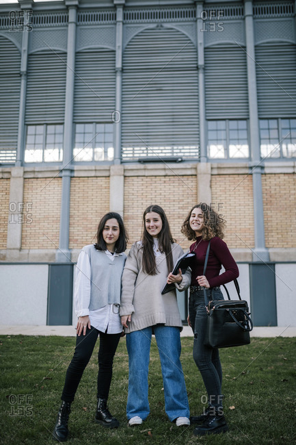 Portrait of three female student friends on college campus