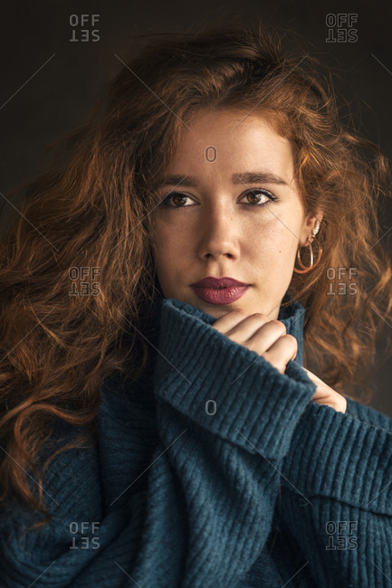 Attractive ginger curly haired young woman portrait