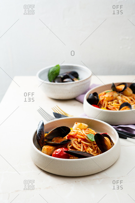 Close up of two spaghetti bowl  with sea foods mussels and scallops