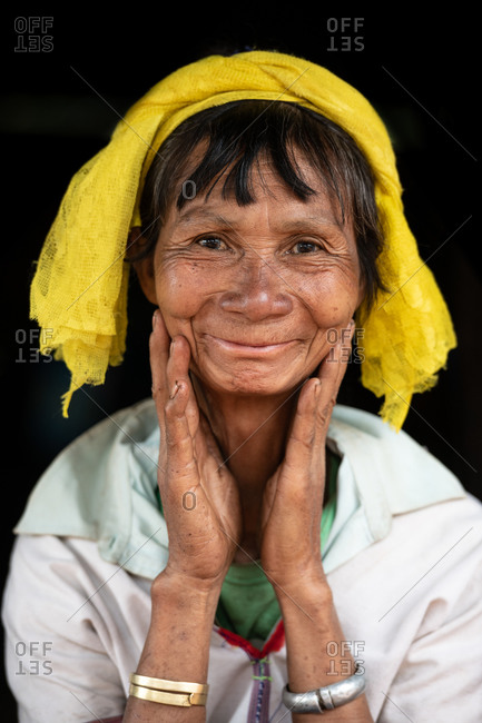 PADUANG PEOPLE,  HILL TRIBE, PAN PET VILLAGE, KAYAH STATE, MYANMAR - 28 January 2019: Portrait of long neck  lady not wearing brass coils placed around the neck, after many years.