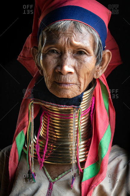 PADUANG PEOPLE,  HILL TRIBE, PAN PET VILLAGE, KAYAH STATE, MYANMAR - 24 November 2019: Portrait of local lady wearing brass coils placed around the neck, appearing to lengthen it.