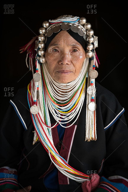 AKHA HILL TRIBE, HOKYIN VILLAGE, MYANMAR - 22 January 2019: Close up portrait of hill tribe women in traditional dress and decorated head dress.