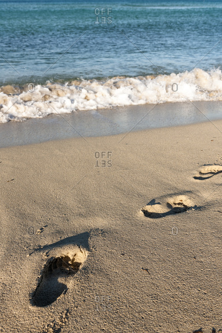 Fresh footprints in beach sand