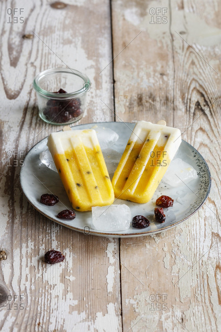 Homemade popsicles with mango and passion fruit