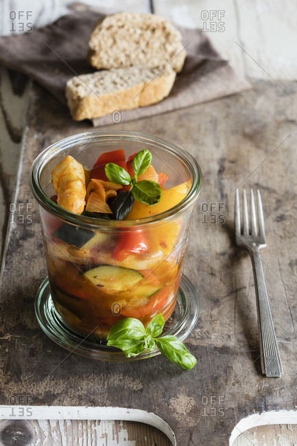 Jar of French ratatouille with asparagus and basil