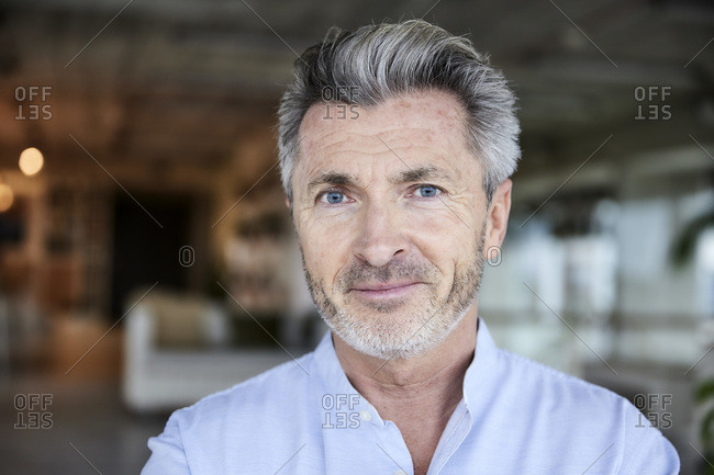 Smiling businessman with blue eyes