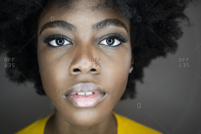 Close-up of woman eyes face with illuminated circular strobe reflection in eyes