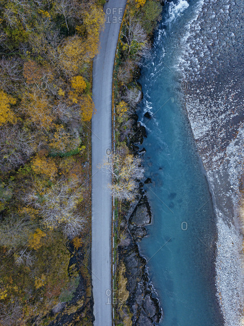 Aerial view of country road stretching along bank of Bzyb River