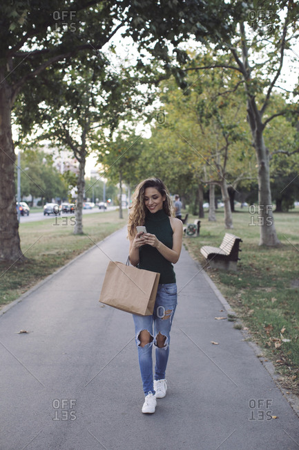 beautiful young woman with shopping bags stock photos OFFSET