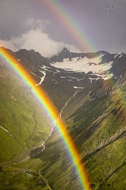 Double rainbow in mountain landscape