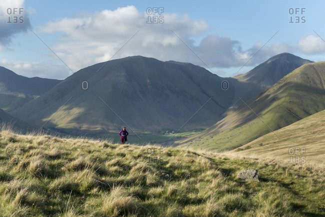 Trekking in the English Lake District in Wast Water with views of Kirk Fell and Great Gable in the distance