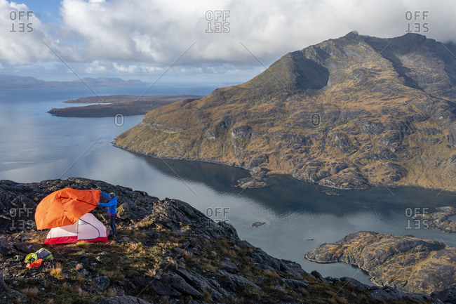 Wild camping on the top of Sgurr Na Stri on the Isle of Skye in the Scottish Highlands with views towards Loch Coruisk and the main Cuillin ridge