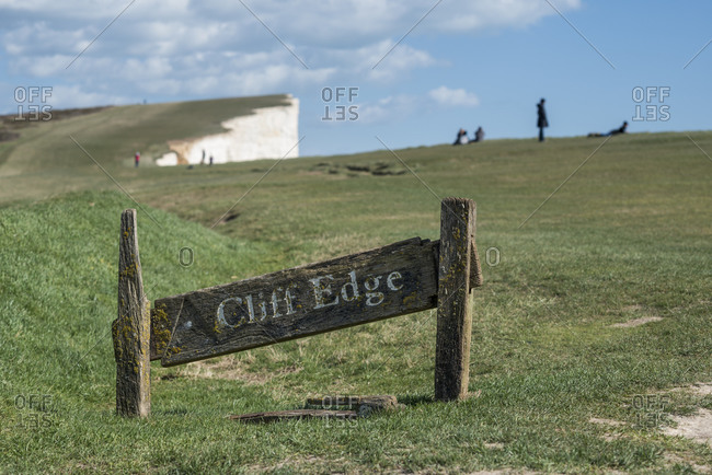 A warning sign near the cliffs at Beachy Head on the south coast of Britain