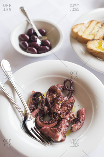 Octopus and olives ready to eat on the Mani peninsula in the Peloponnese in Greece