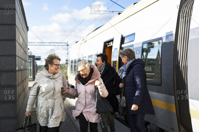 Passengers at train platform - Offset Collection