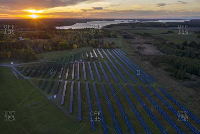Aerial view of solar farm at sunset