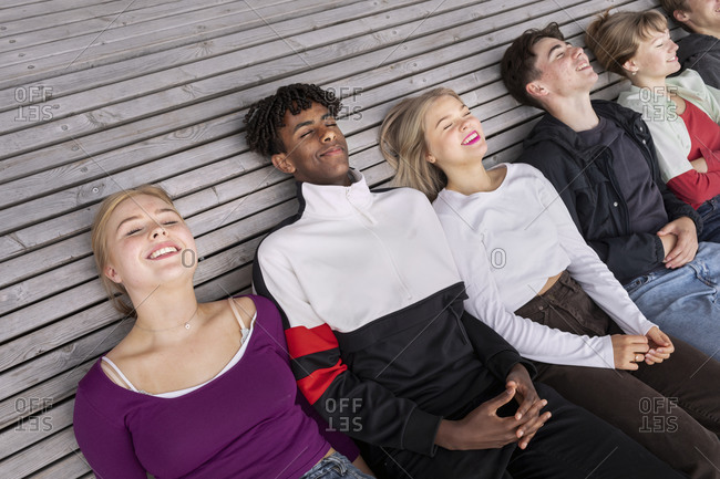 High angle view of teenage friends relaxing together