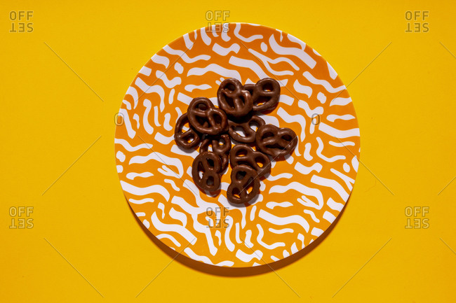 Studio shot of plate with chocolate pretzels
