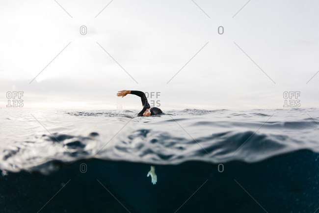 Man swimming alone in sea