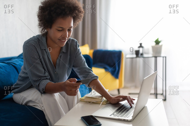 Black woman making online purchases