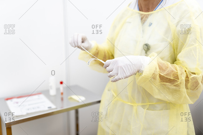 nurse takes sample for covid-19