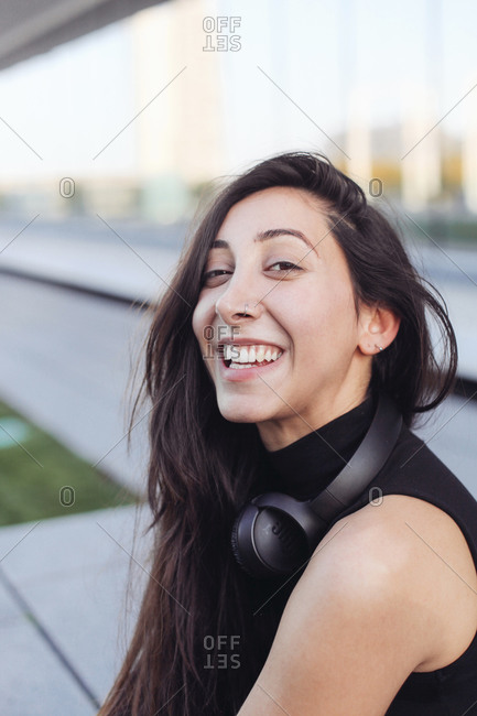 Young girl laughing and looking at the camera