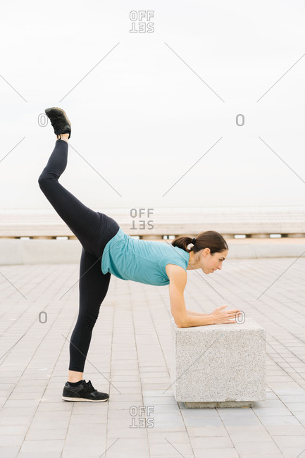little girl stretching stock photos - OFFSET