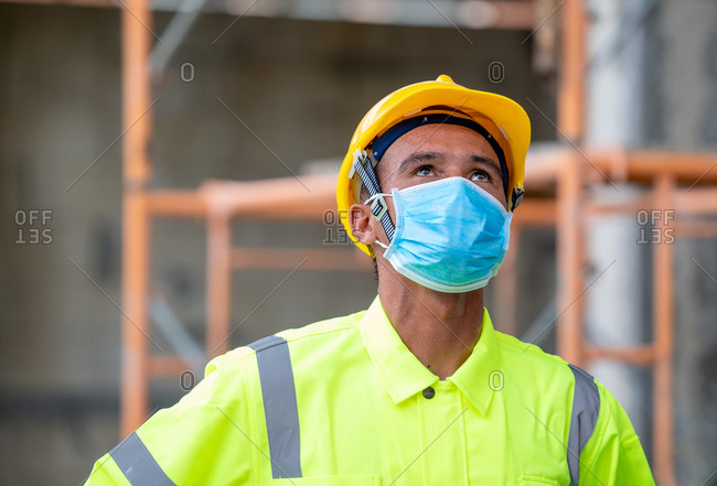 Construction worker wear protective face masks for safety in con