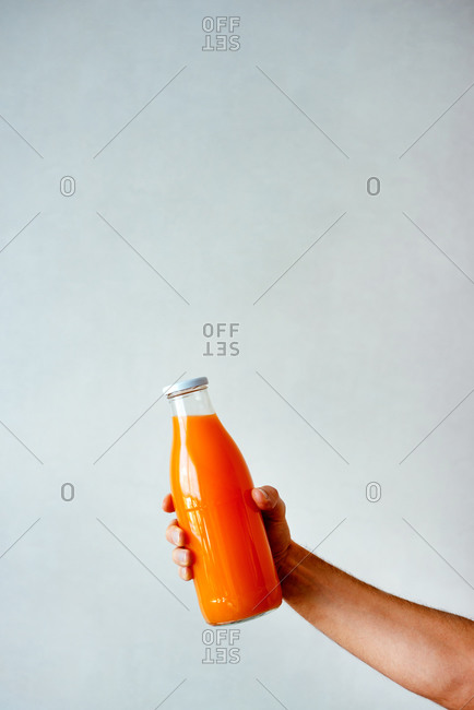 Freshly squeezed orange juice on white background