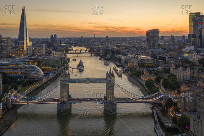 Aerial view of the Tower Bridge and the Shard building with London skyline at sunset, United Kingdom.